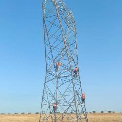 Workers installing an electricity pylon