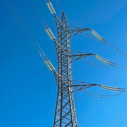 Power lines connecting to a metal tower