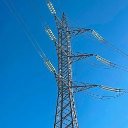 Power lines connecting to a metal tower